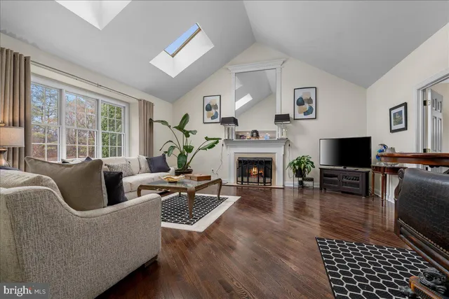 a room with pool table and windows