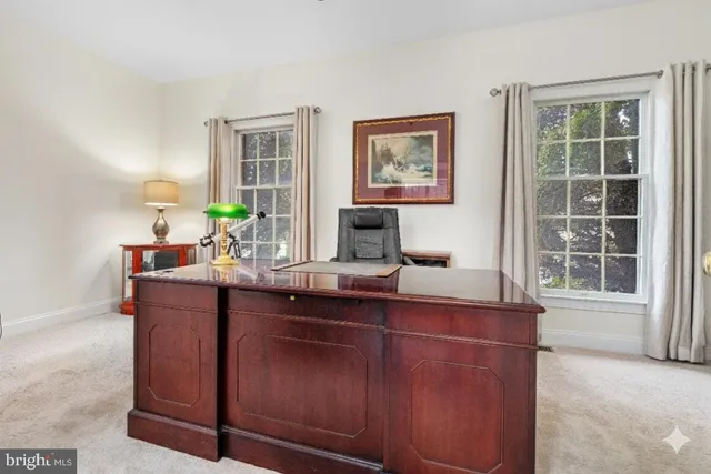 a spacious bedroom with a bed a couch and a window