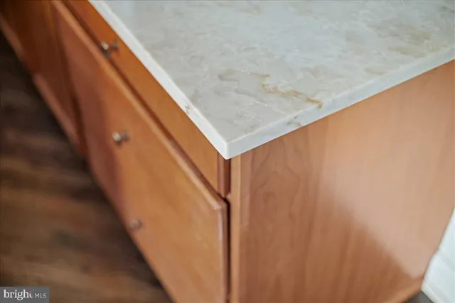 a kitchen with stainless steel appliances granite countertop a sink a counter space and cabinets