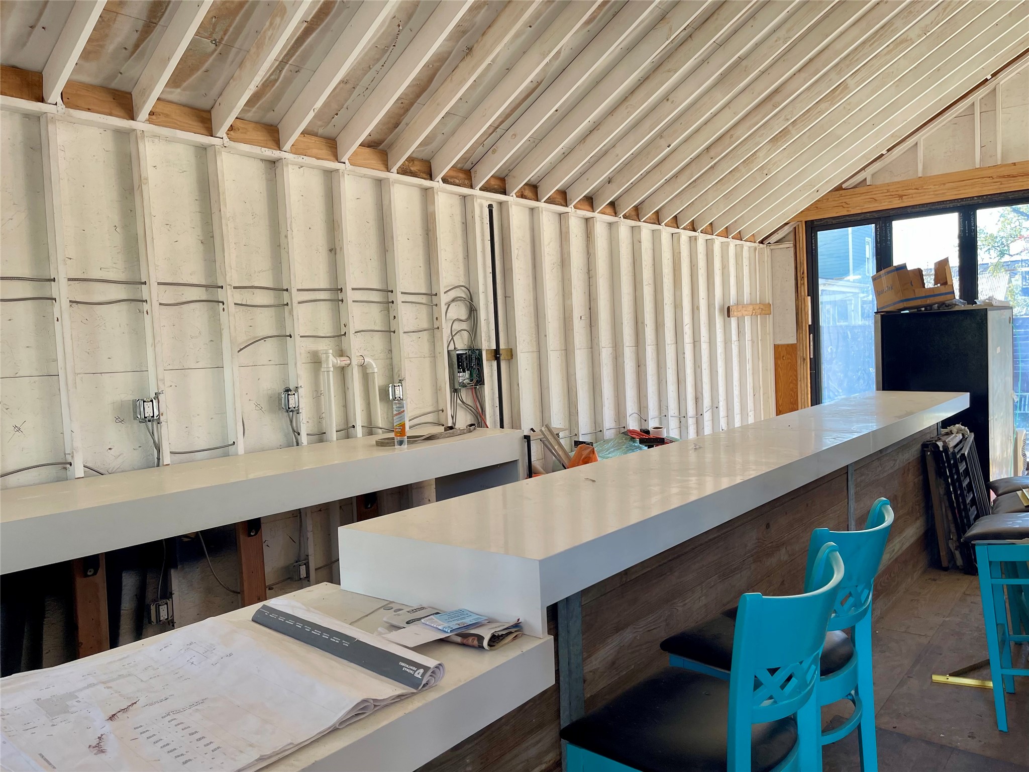 1807 Lawrence Street Houston, TX 77008 - Photo 3 of 10 a room with stainless steel appliances wooden cabinets a table and chairs