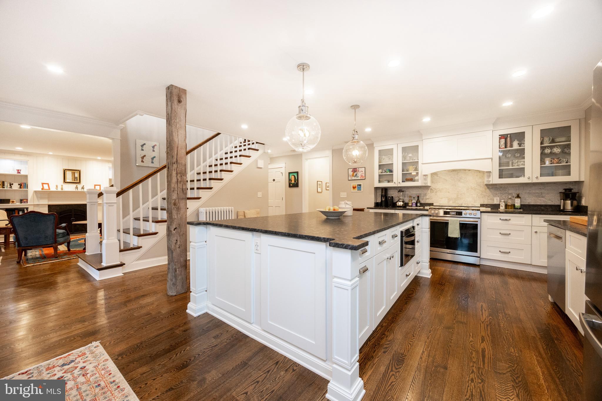 57 Grubb Road Malvern, PA 19355 - Photo 11 of 45 a kitchen with stainless steel appliances granite countertop a stove and a wooden floors