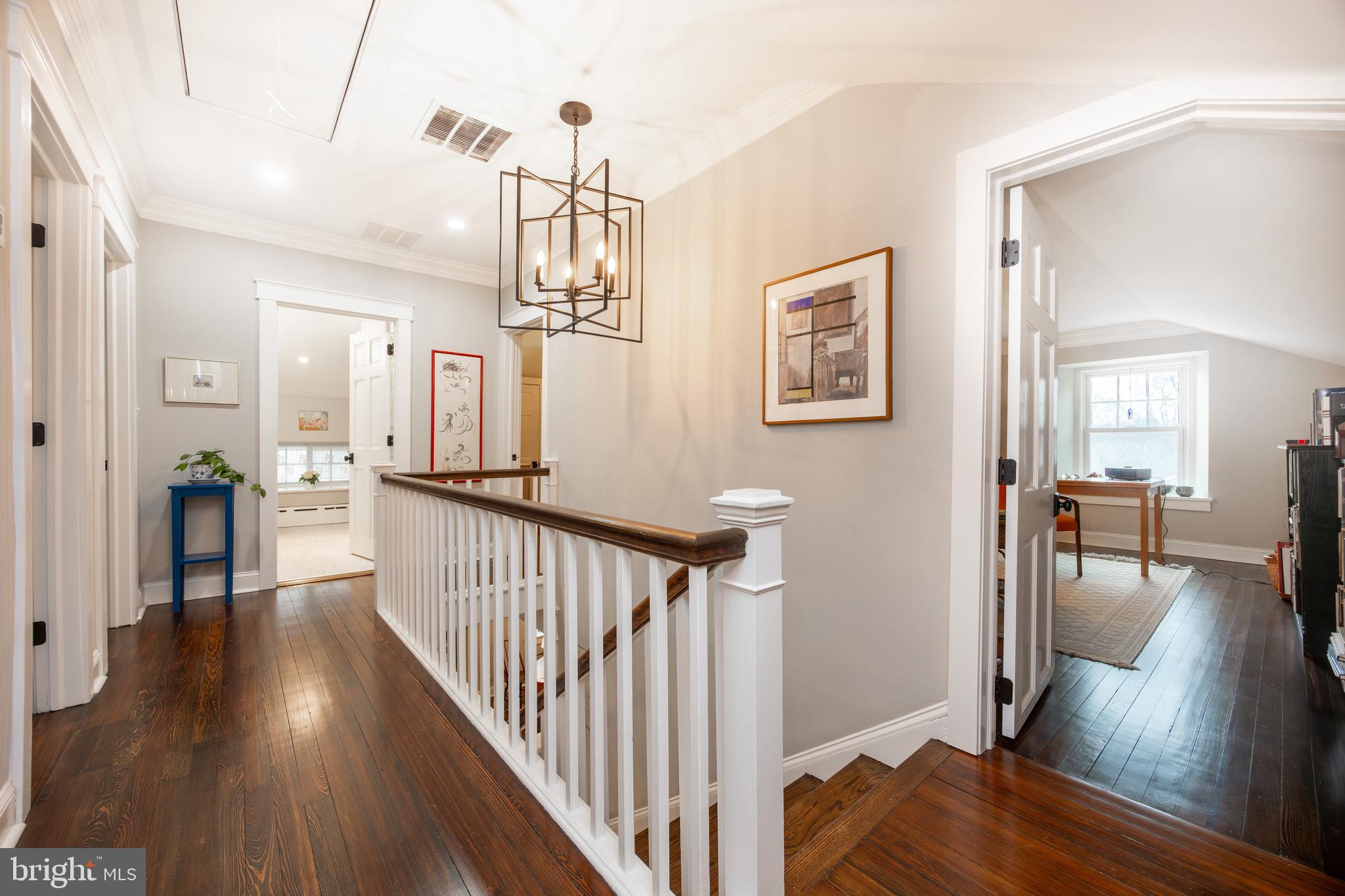 57 Grubb Road Malvern, PA 19355 - Photo 22 of 45 a view of a hallway to a livingroom with wooden floor and furniture