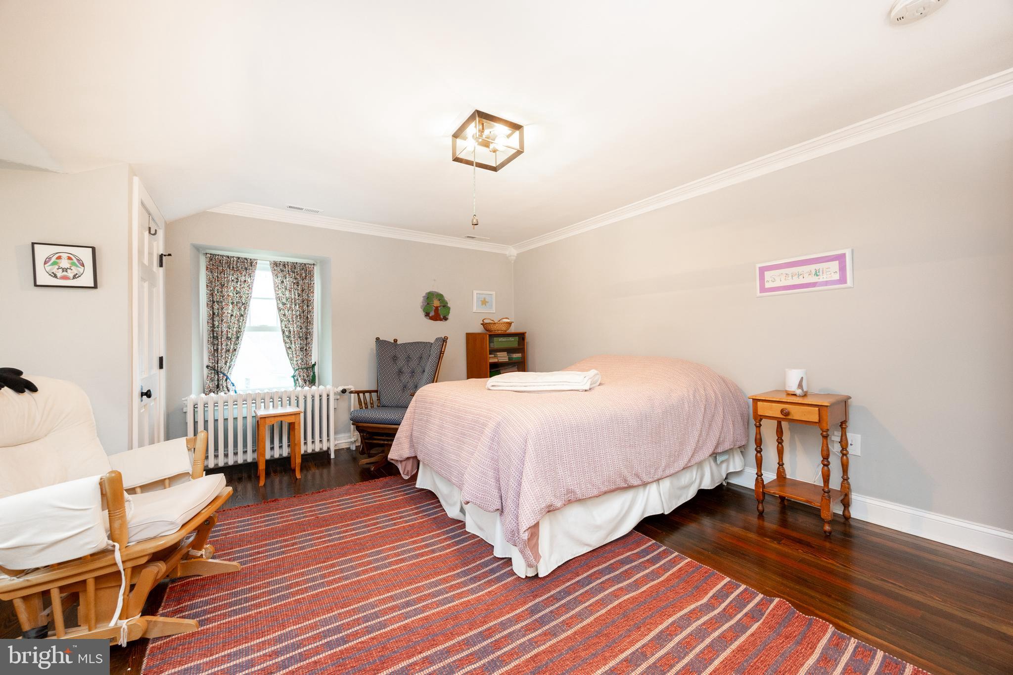 57 Grubb Road Malvern, PA 19355 - Photo 27 of 45 a bed room with a bed and a chair