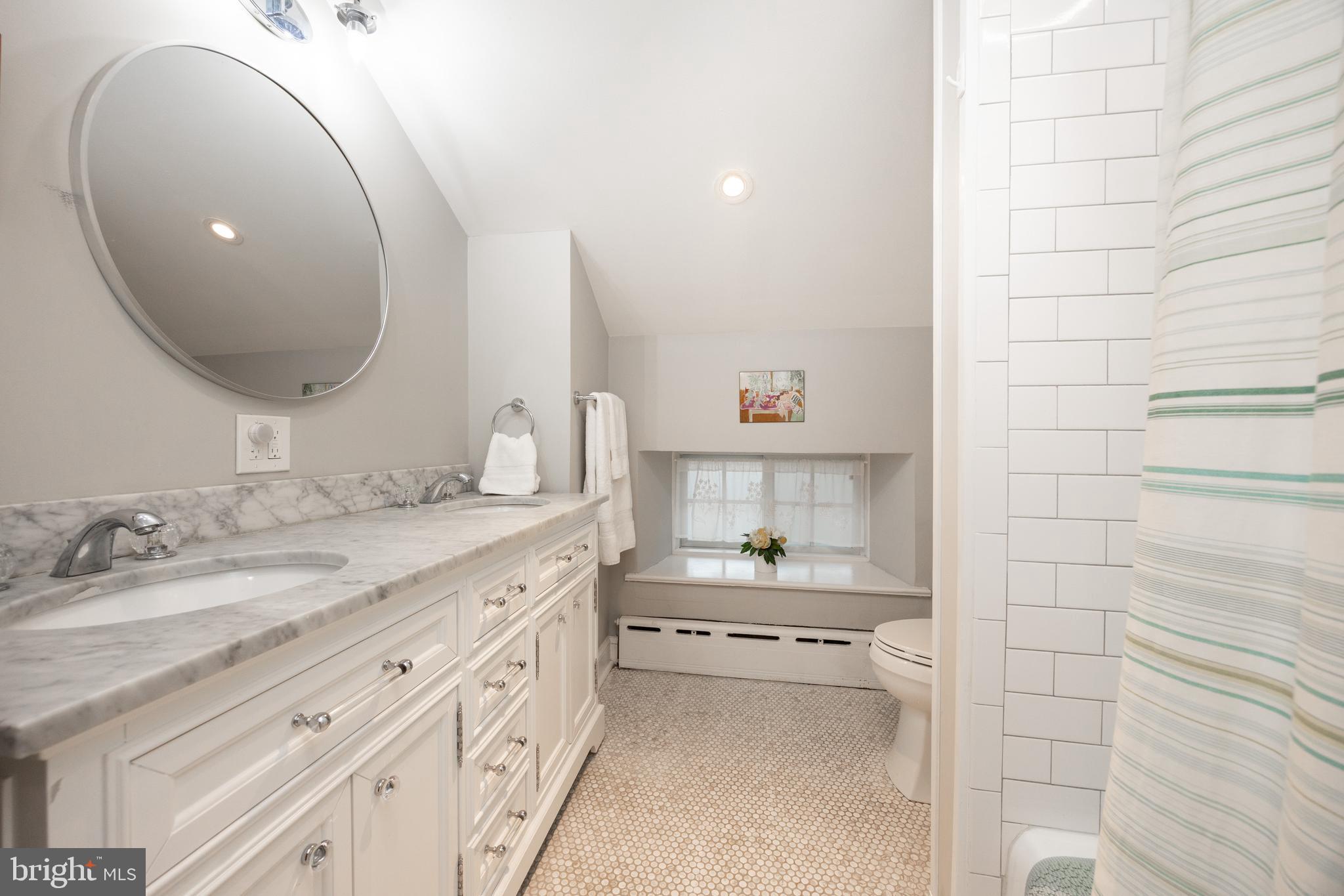 57 Grubb Road Malvern, PA 19355 - Photo 31 of 45 a spacious bathroom with a double vanity sink and a mirror