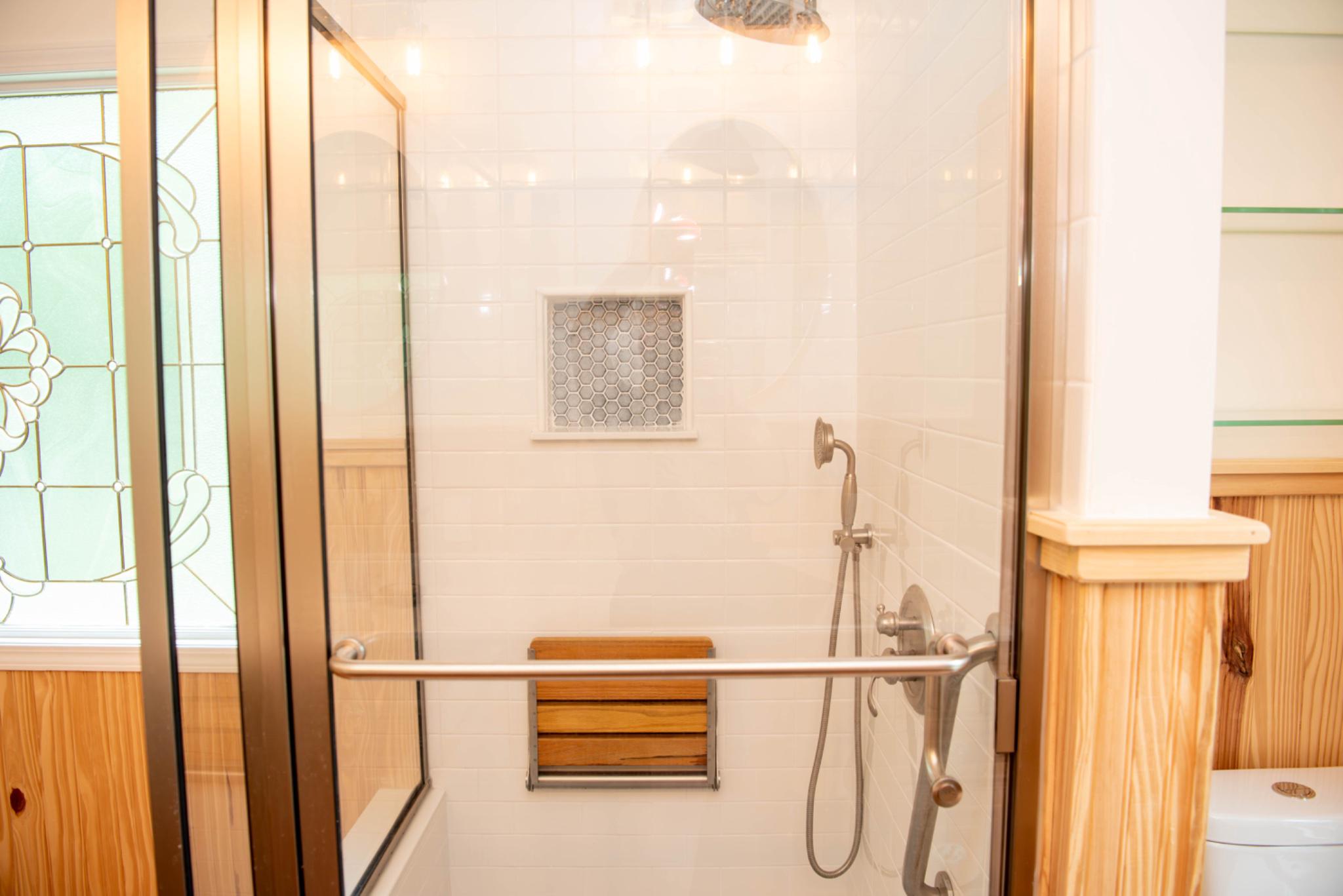 792 Forest Glen Road Moorefield, WV 26836 - Photo 69 of 146 Elegant walk-in glass shower with wooden accents.