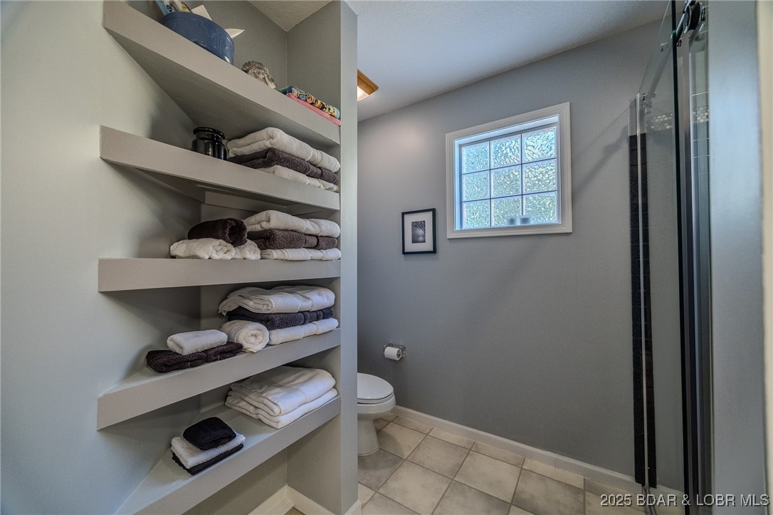 2259 Standing Rock Road Camdenton, MO 65020 - Photo 30 of 75 Convenient towel shelving keeps essentials accessi
