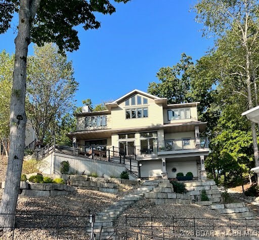 2259 Standing Rock Road Camdenton, MO 65020 - Photo 3 of 75 Perched gracefully above the lake, this stunning p