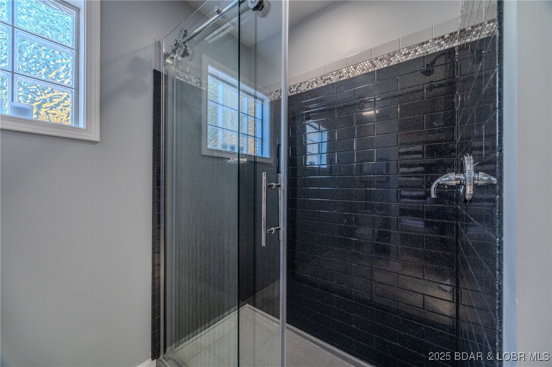 2259 Standing Rock Road Camdenton, MO 65020 - Photo 31 of 75 Indulge in a spa-inspired walk-in shower designed