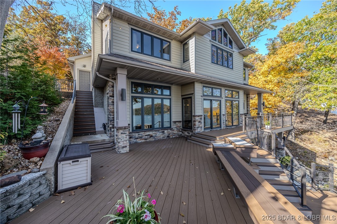 2259 Standing Rock Road Camdenton, MO 65020 - Photo 4 of 75 The upper deck offers seamless indoor-outdoor flow