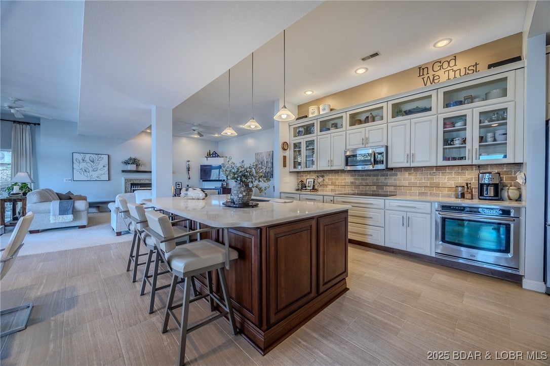 2259 Standing Rock Road Camdenton, MO 65020 - Photo 43 of 75 The large central island, featuring dark wood cabi