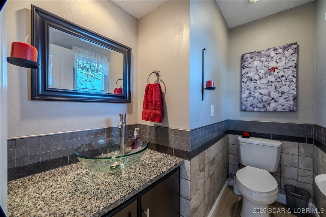 2259 Standing Rock Road Camdenton, MO 65020 - Photo 56 of 75 Half bath just off the kitchen and deck ensures se