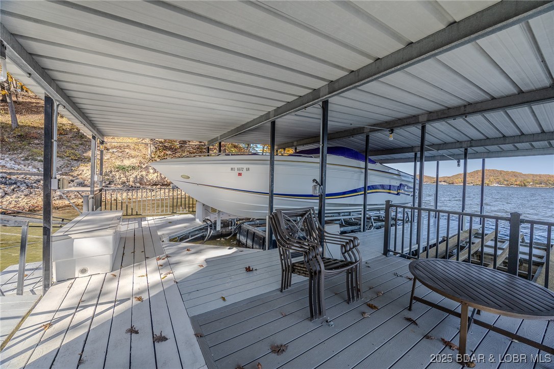 2259 Standing Rock Road Camdenton, MO 65020 - Photo 66 of 75 A covered, multi-slip dock with a sturdy metal roo