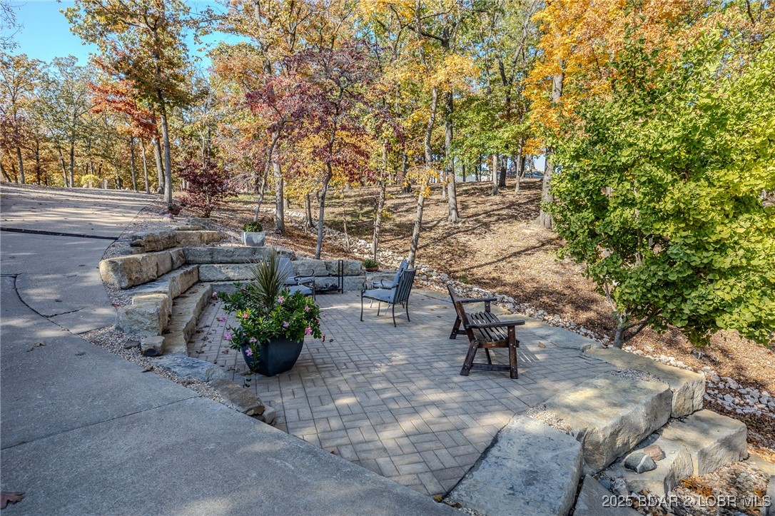 2259 Standing Rock Road Camdenton, MO 65020 - Photo 9 of 75 Surrounded by mature trees and lush landscaping, t