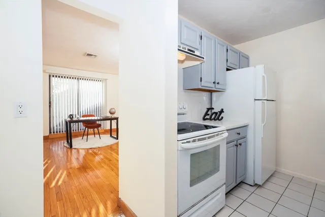 a view of kitchen with furniture and wooden floor