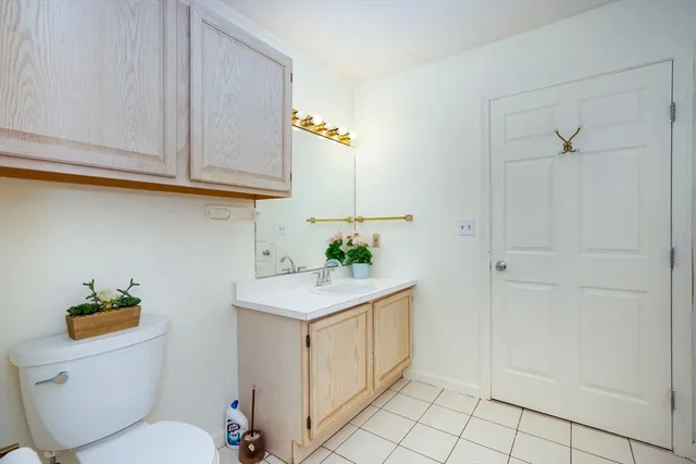 a bathroom with a sink a toilet and vanity