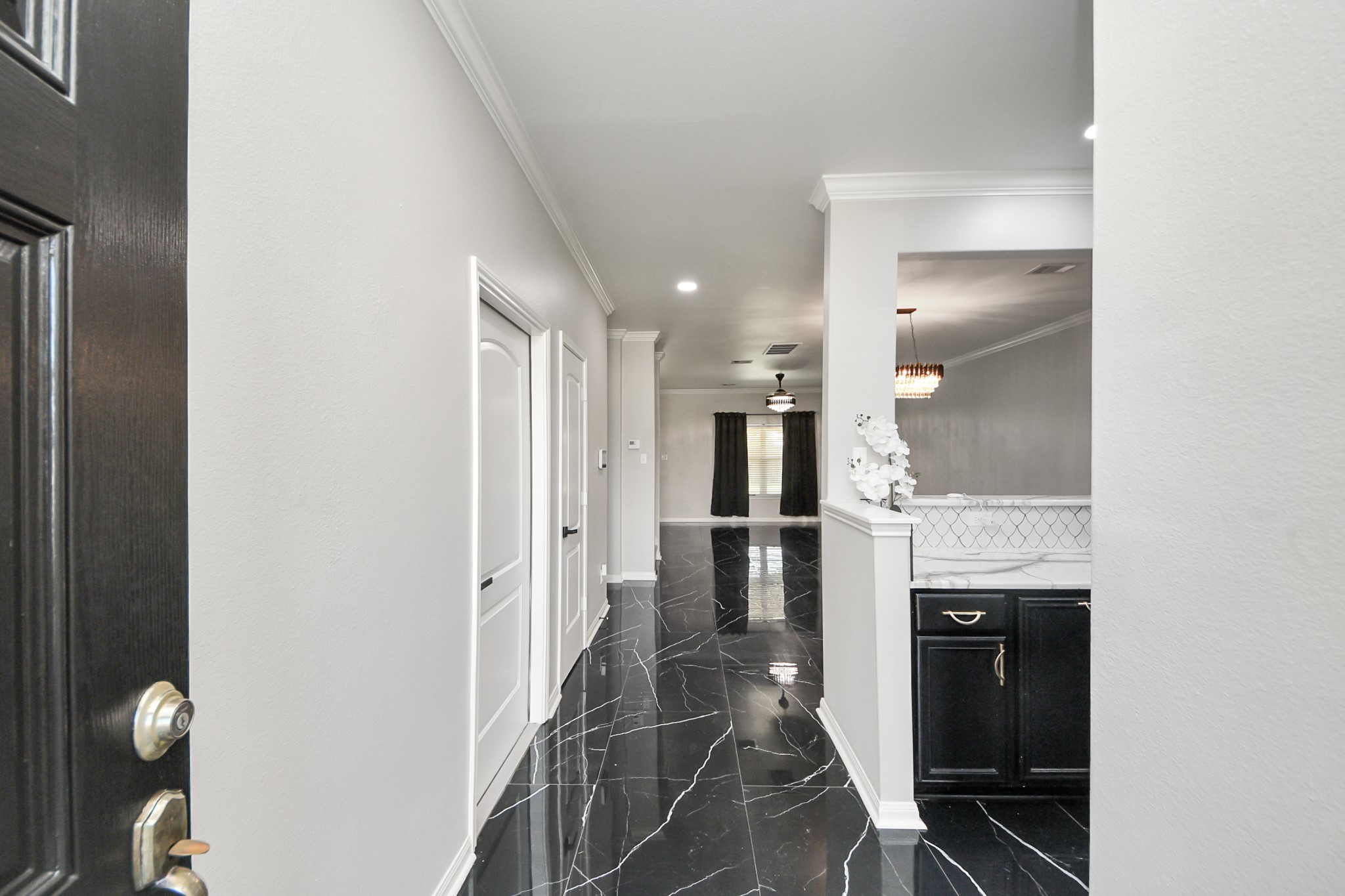 6931 Primrose Road Baytown, TX 77521 - Photo 5 of 50 Welcoming entryway with sleek black marble floors and elegant finishes.