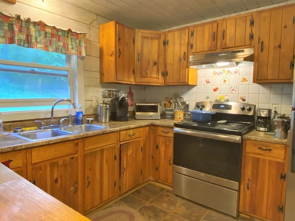266 Alexander Road Leyden, MA 01337 - Photo 12 of 33 a kitchen with stainless steel appliances granite countertop a sink stove and cabinets
