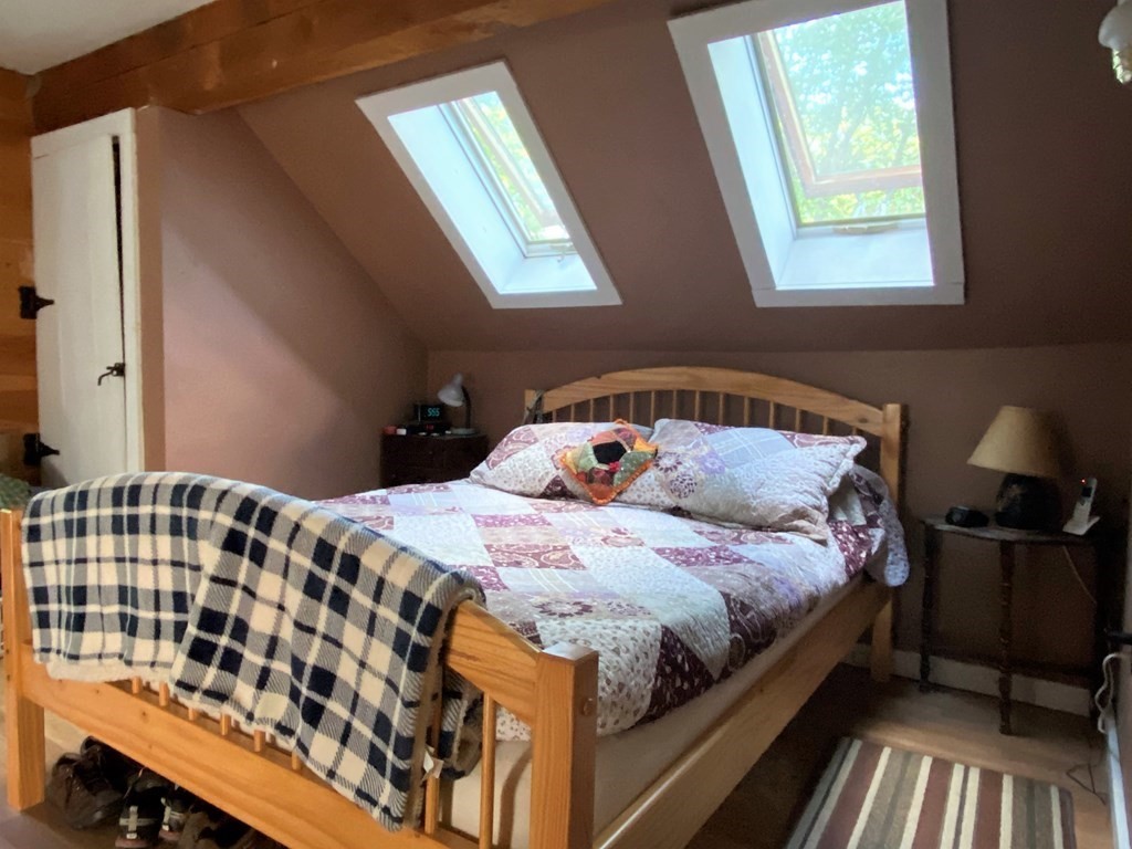 266 Alexander Road Leyden, MA 01337 - Photo 23 of 33 a bedroom with a bed and wooden floor