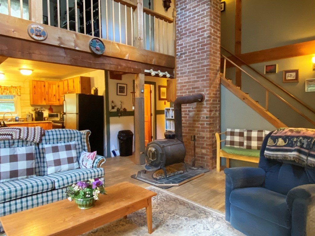 266 Alexander Road Leyden, MA 01337 - Photo 6 of 33 a view of a chairs and a potted plant