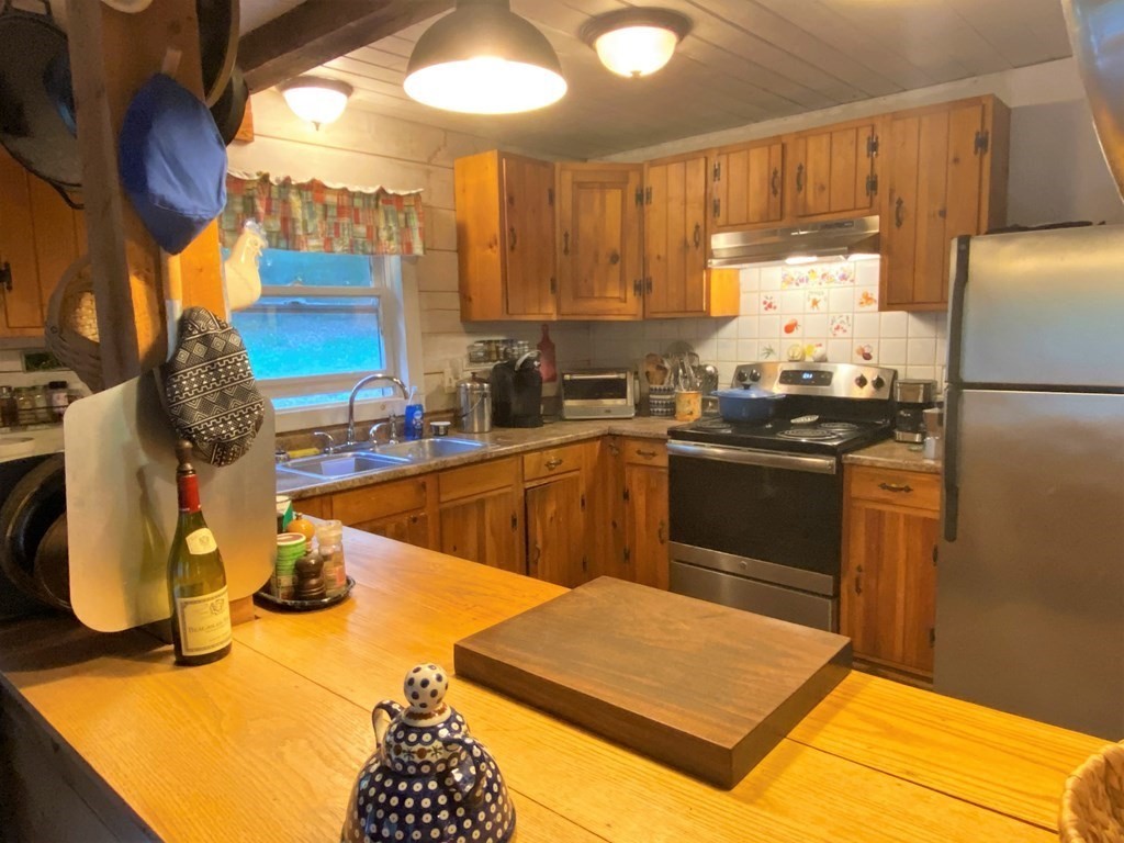 266 Alexander Road Leyden, MA 01337 - Photo 8 of 33 a kitchen with a sink appliances and cabinets