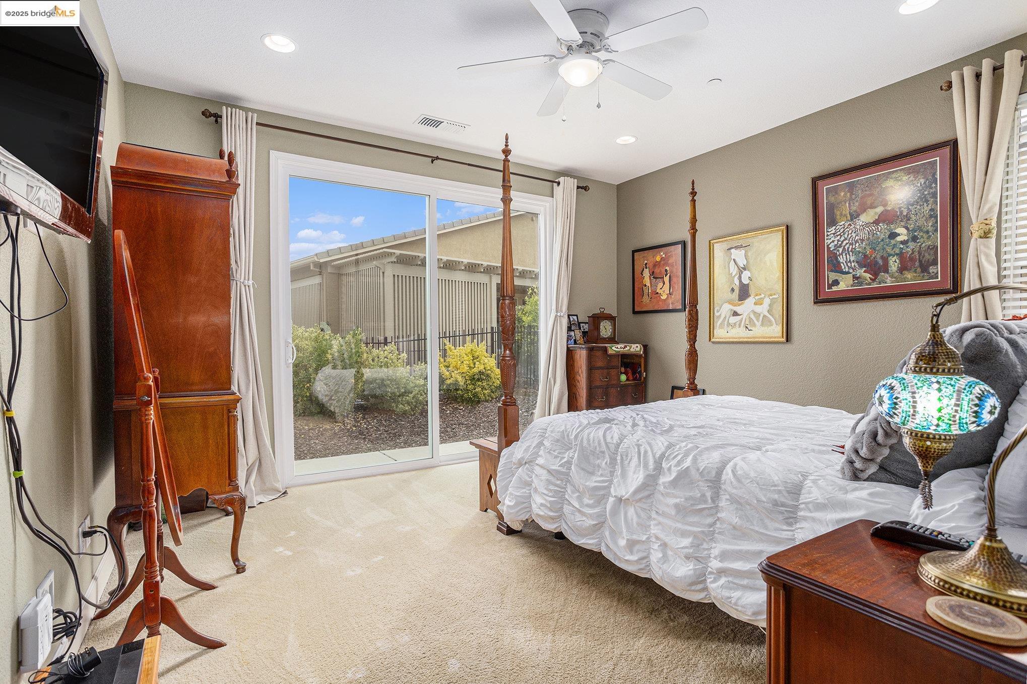 299 Marks Road Rio Vista, CA 94571 - Photo 14 of 39 Bedroom featuring light colored carpet, access to exterior, a ceiling fan, and recessed lighting