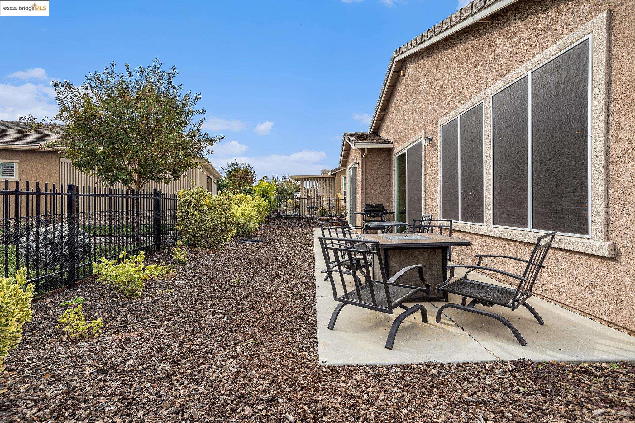 299 Marks Road Rio Vista, CA 94571 - Photo 21 of 39 Fenced backyard featuring a patio and outdoor dining area