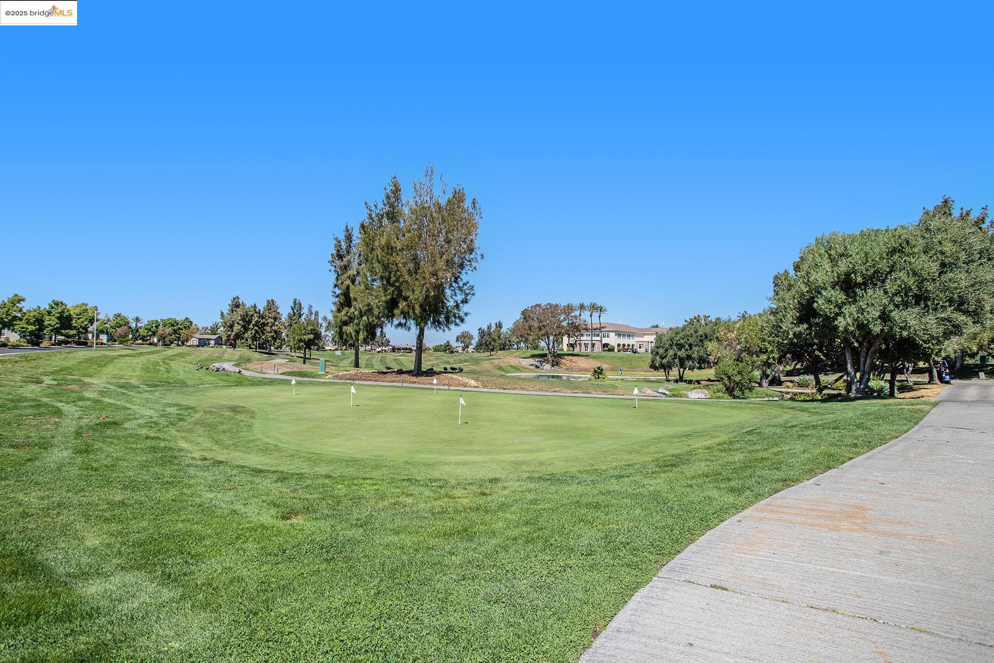 299 Marks Road Rio Vista, CA 94571 - Photo 31 of 39 View of community featuring view of golf course, a putting area, and a yard