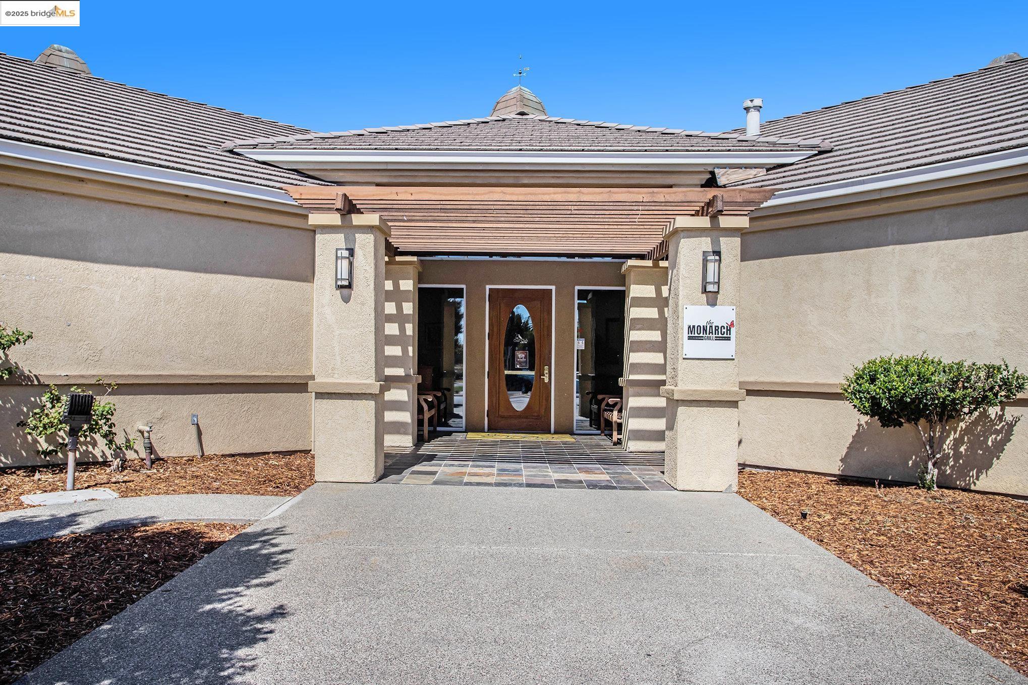 299 Marks Road Rio Vista, CA 94571 - Photo 32 of 39 View of exterior entry featuring stucco siding, a chimney, and a tile roof