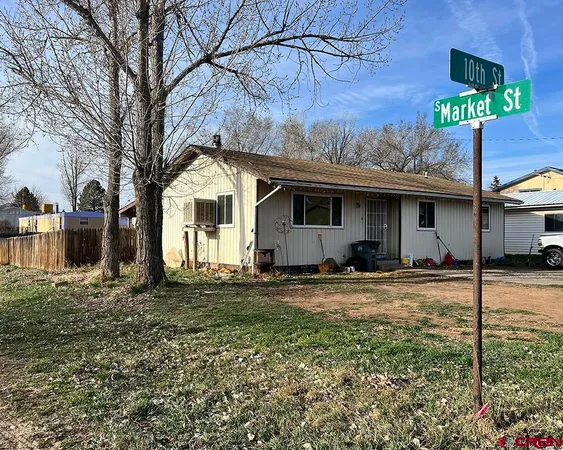 a front view of a house with yard