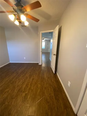 a view of a livingroom with wooden floor
