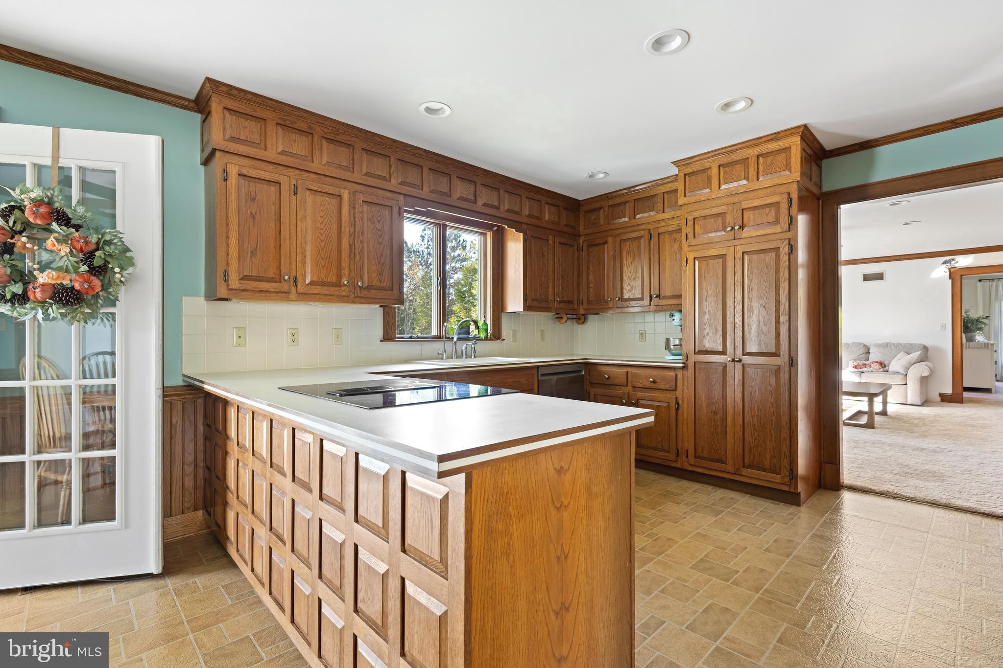 930 Johnson Road Salisbury, MD 21804 - Photo 27 of 69 a kitchen with stainless steel appliances granite countertop a sink stove and refrigerator