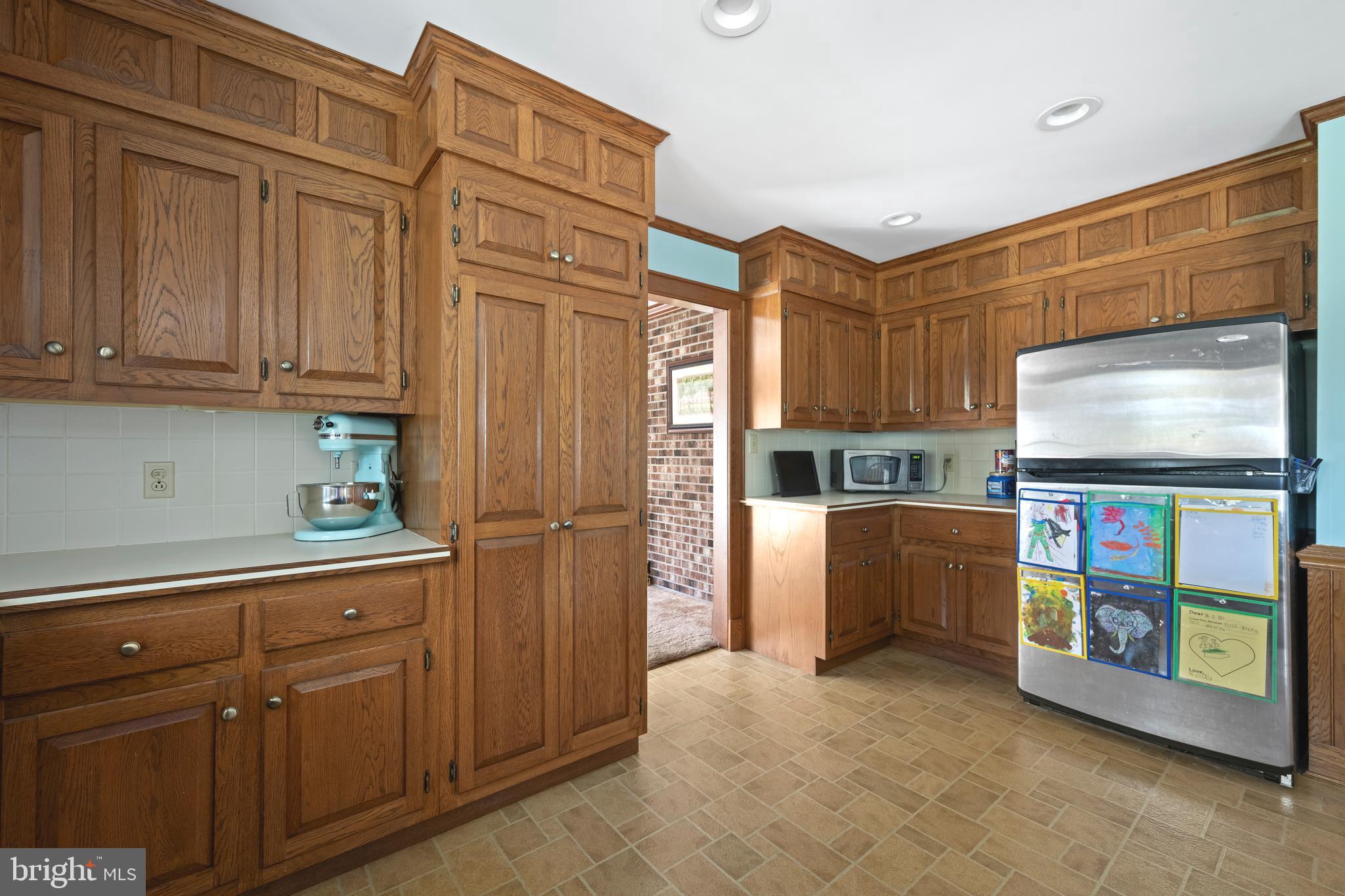 930 Johnson Road Salisbury, MD 21804 - Photo 31 of 69 a kitchen with stainless steel appliances granite countertop a refrigerator and cabinets