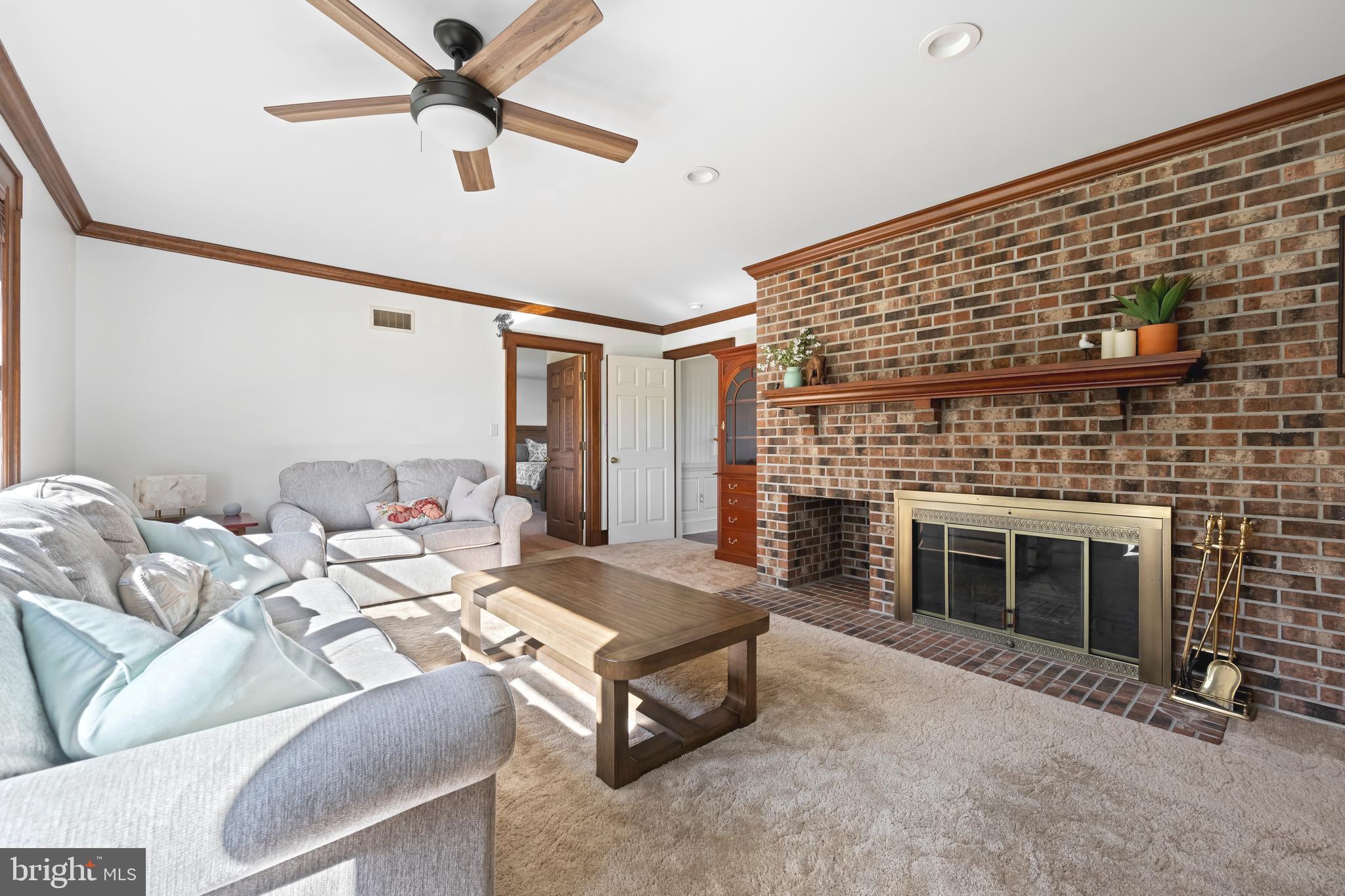 930 Johnson Road Salisbury, MD 21804 - Photo 42 of 69 a living room with furniture and a fireplace