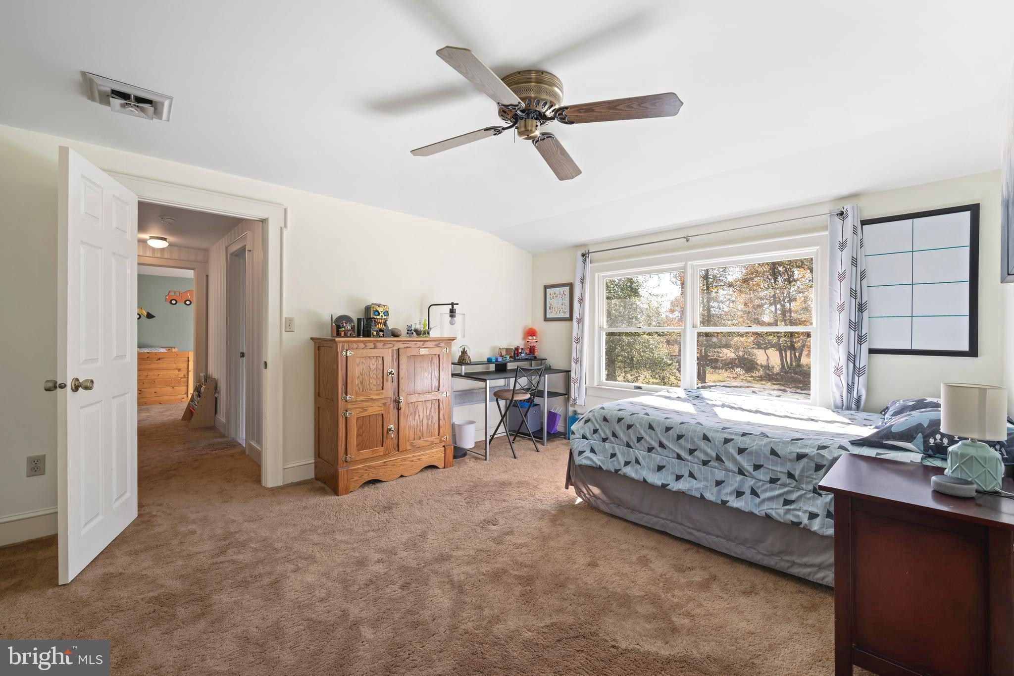 930 Johnson Road Salisbury, MD 21804 - Photo 54 of 69 a bed room with a bed and a chair