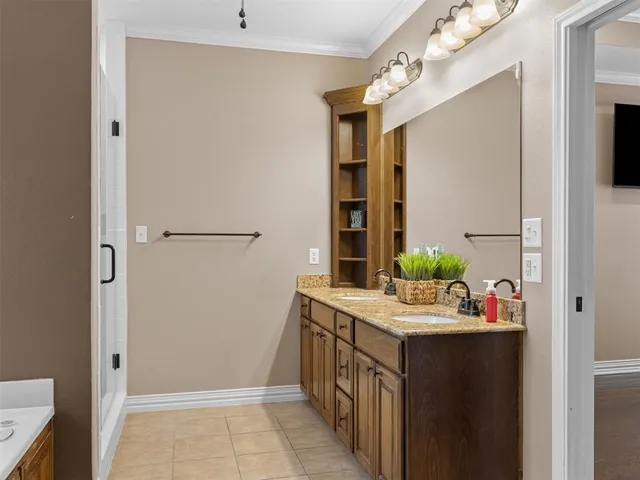 a bathroom with a sink vanity and mirror