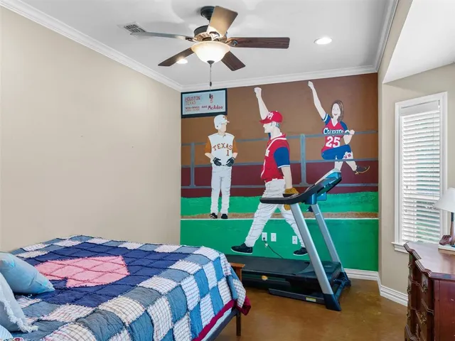 a bedroom with a bed and a flat tv screen