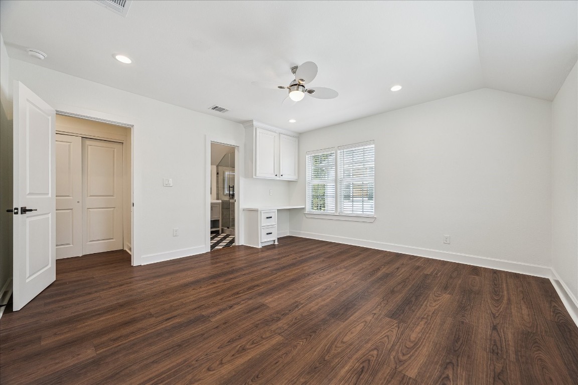 3071 Locke Lane Houston, TX 77019 - Photo 30 of 44 an empty room with wooden floor cabinet and windows