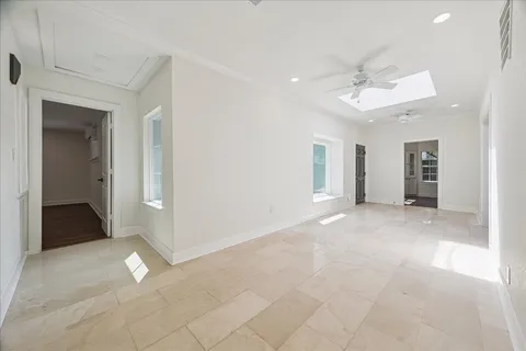 a large kitchen with stainless steel appliances kitchen island a large counter top and stove top oven
