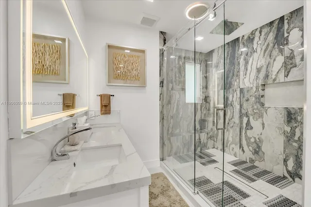 a bathroom with a sink and a shower