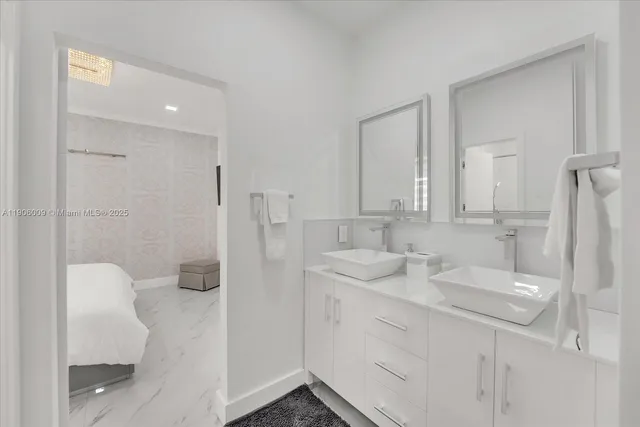 a bathroom with a sink and mirror