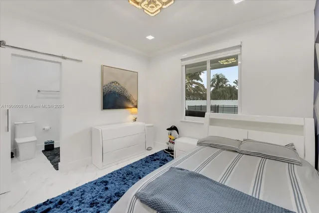 a bed room with a bed and a window