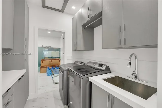 a kitchen that has a sink and a stove