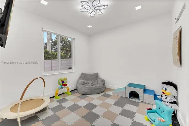 a bedroom with furniture and a window