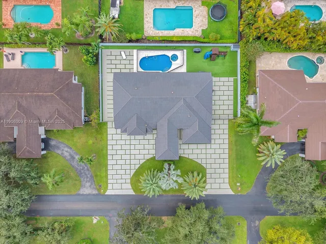 an aerial view of a house with a garden