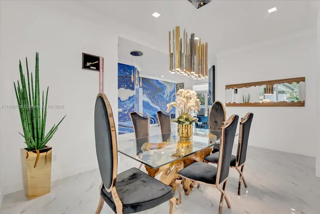 a dining room with furniture and potted plants