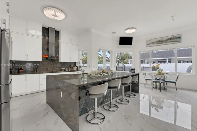 a kitchen with lots of counter top space and dining table