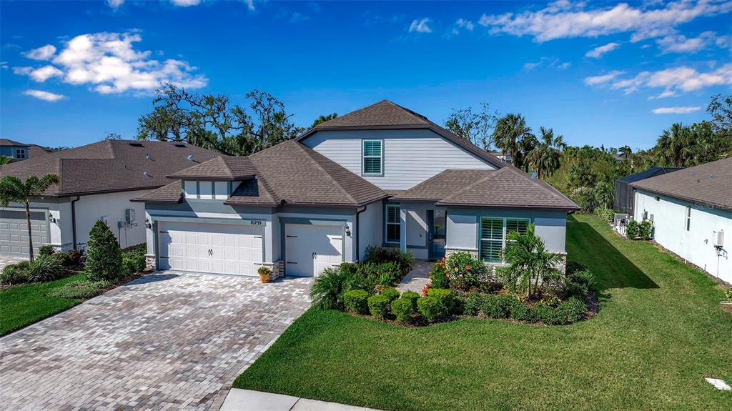 10739 Spring Tide Way Palmetto, FL 34221 - Photo 1 of 1 a front view of a house with a yard