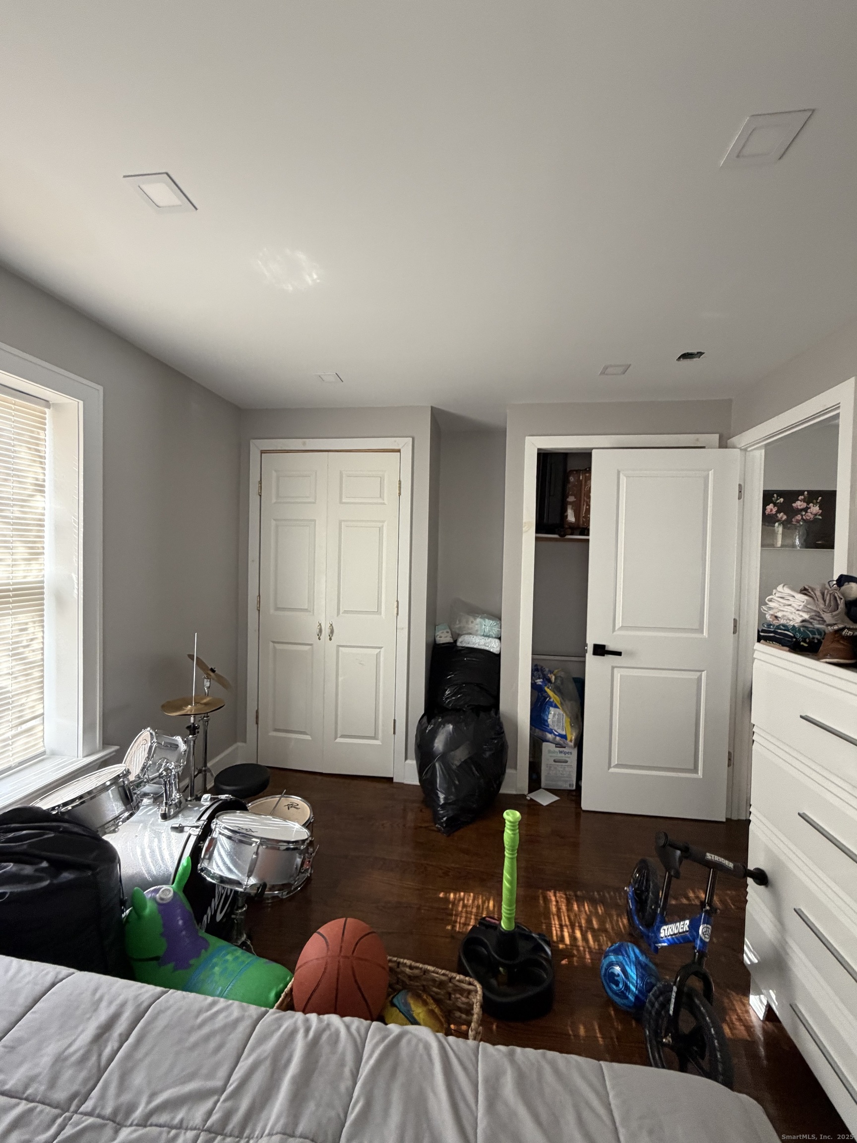 2964 State Street, Unit 2 Hamden, CT 06517 - Photo 13 of 16 a bedroom with furniture and a window