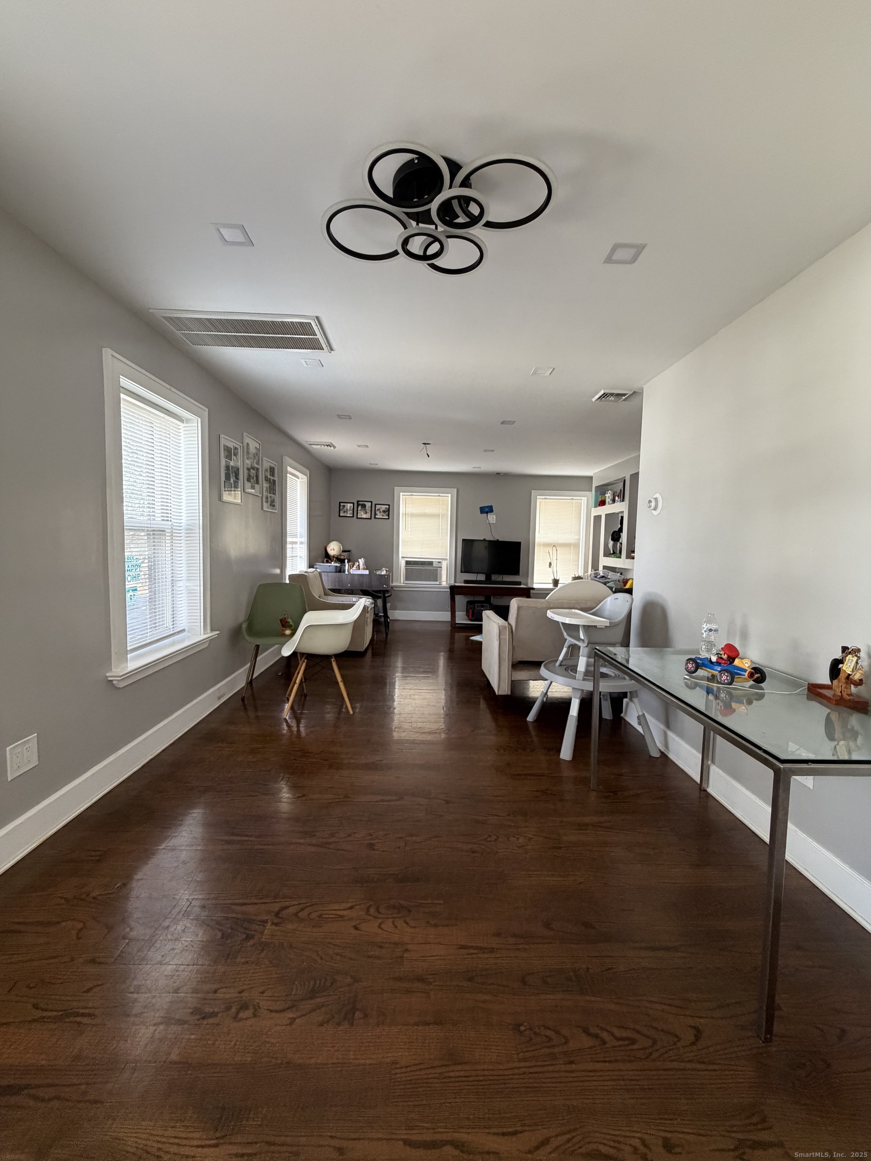 2964 State Street, Unit 2 Hamden, CT 06517 - Photo 7 of 16 a living room with furniture and a window