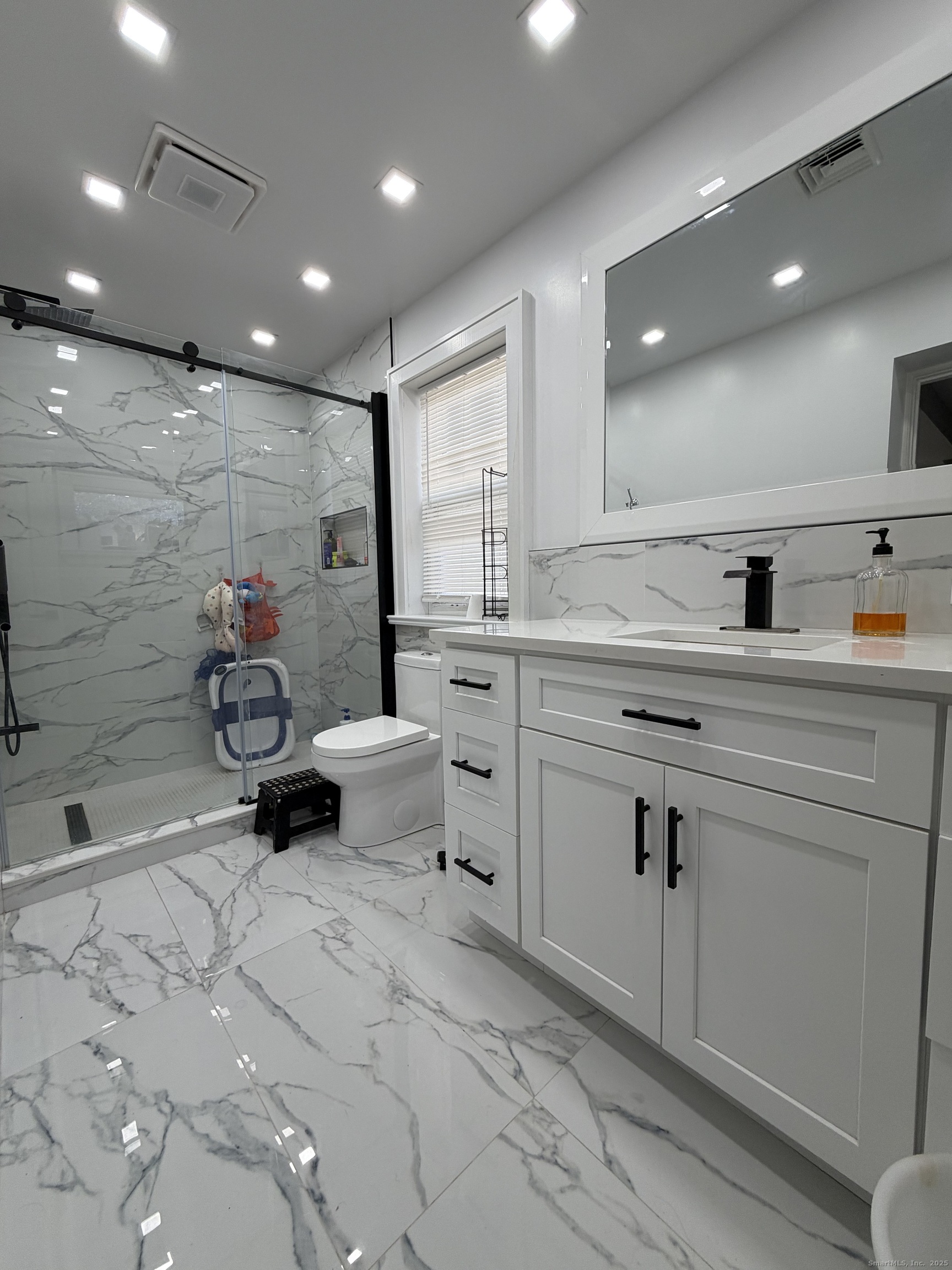 2964 State Street, Unit 2 Hamden, CT 06517 - Photo 9 of 16 a kitchen with sink cabinets and window